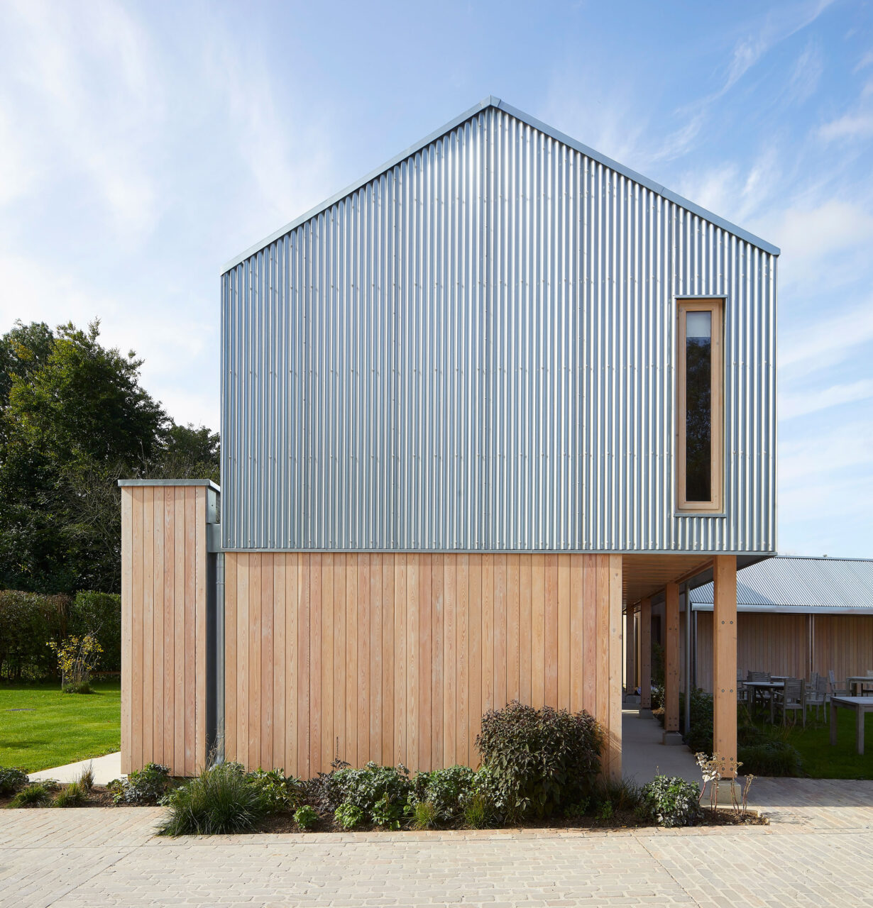 External view of Grade II listed Alice Hawthorn Hotel with new timber frame outbuildings
