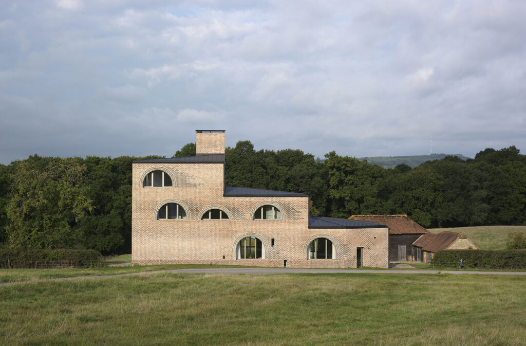 External view of the converted RIBA Award winning Nithurst Farm, a new-build family home situated in the South Downs National Park.
